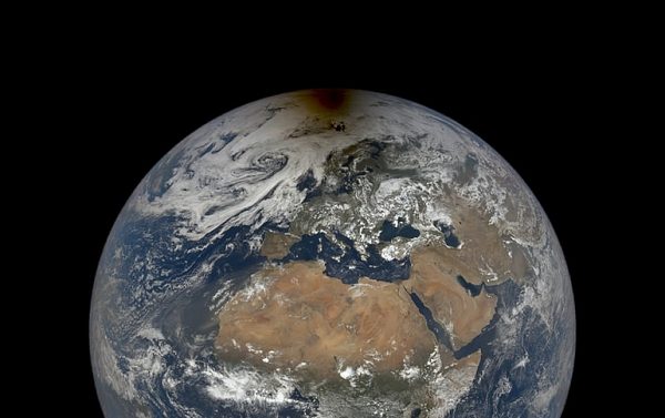 NASA shares image of the moon's shadow over the Arctic