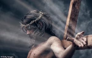 Mystery of Christ's death solved? Jesus died from fatal bleeding after dislocating his shoulder carrying the cross, claims doctor-turned-priest