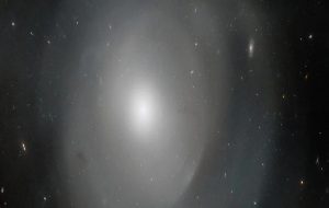 Hubble Peers Through The Mysterious Shells of This Gigantic Elliptical Galaxy