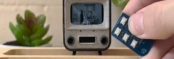 Magnifying glasses at the ready! World's smallest TV is the same size as a postage stamp - but functions just like a full-size device