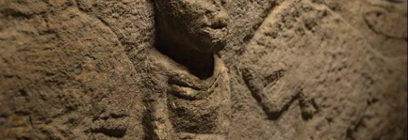 Man holding penis and flanked by leopards is world's oldest narrative carving