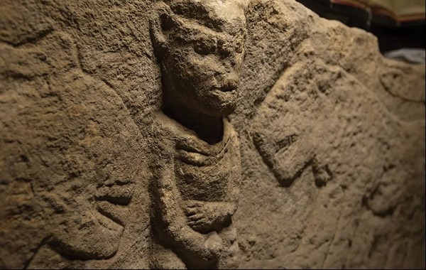 Man holding penis and flanked by leopards is world's oldest narrative carving