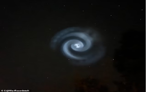 Mystery as huge spinning white spiral spotted in the skies above Britain