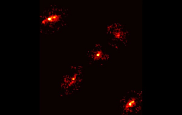 Rare Einstein cross with extra image reveals hidden dark matter