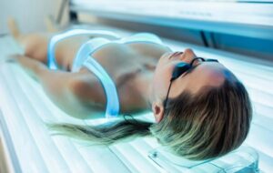 The Tanning Booth Time Bomb: New Study Reveals Your Skin's DNA is Aging DECADES Faster